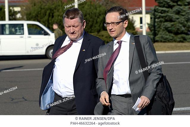 German Health Minister Hermann Groehe (CDU) and German Minister of Justice Heiko Maas (SPD) walk to a government aircraft at Tegel airport in Berlin, Germany