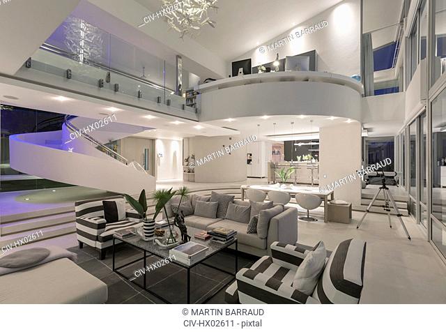 Illuminated modern luxury home showcase interior open plan