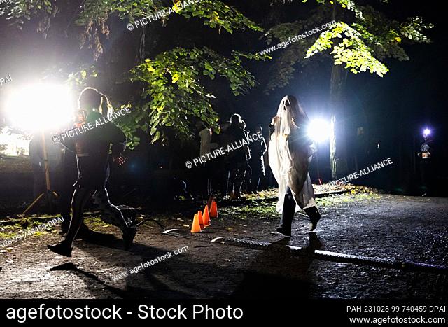 28 October 2023, Berlin: One person takes part as a ghost in the Halloween Run Berlin 2023. The route leads through the Volkspark Jungfernheide