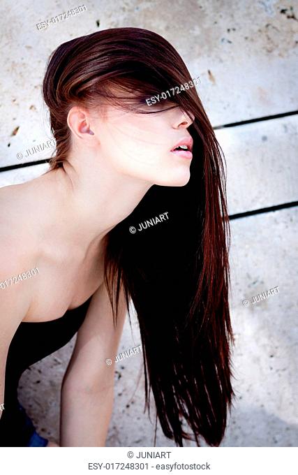 beautiful woman portrait wirth long straight dark brown hair sensual haircare
