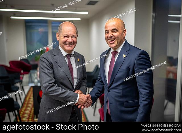 16 October 2023, Albania, Tirana: German Chancellor Olaf Scholz (l, SPD), stands next to Dimitar Kovacevski, Prime Minister of Northern Macedonia
