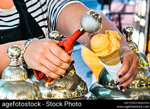 Ice Cream seller sells scoop of ice-cream in Brno, Czech Republic, October 4, 2023. (CTK Photo/Patrik Uhlir)