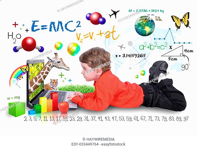 A young boy child is looking at a laptop computer with math, science and animals around him. He is on a white background