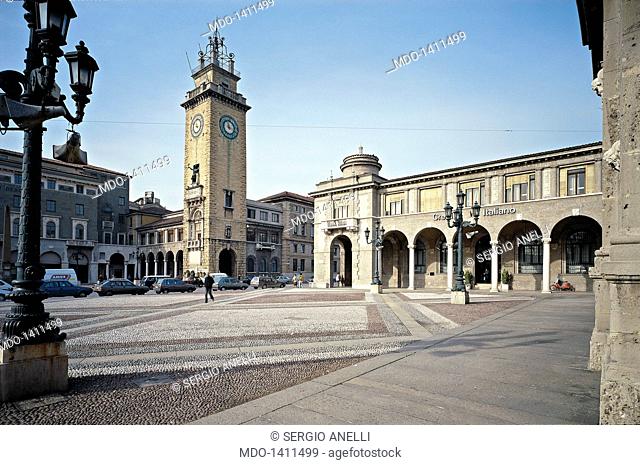 Piazza Vittorio Veneto, by Piacentini Marcello, 1907, 20th Century. Italy, Lombardy, Bergamo. Detail. View of the portico and the clocktower