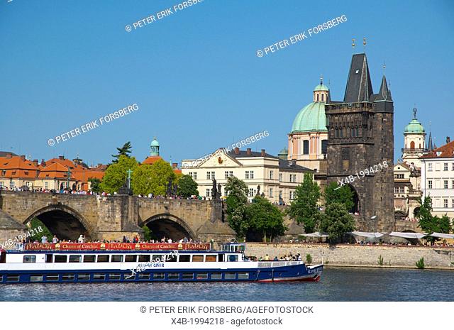 Sightseeing tour boat at Charles Bridge on river Vltava Prague city Czech Republic Europe
