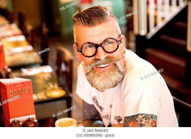 Quirky man in bar and restaurant, Bournemouth, England