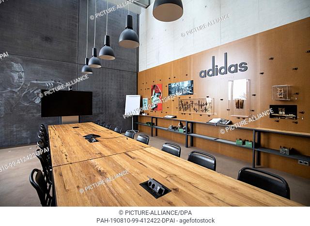 09 August 2019, Bavaria, Herzogenaurach: View into a meeting room designed as a workshop in a new office building of the sporting goods manufacturer adidas