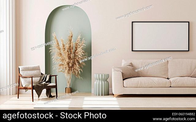 empty picture frame on beige wall in living room interior with modern furniture and decorative green arch with trendy dried flowers, white sofa and armchair