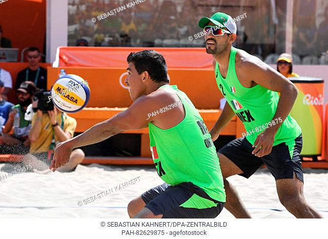 Rodolfo Lombardo Ontiveros Gomez (L) and Juan Ramon Virgen Pulido from Mexico in action during the Men's Preliminary - Pool C match Dalhausser/Lucena of the USA...
