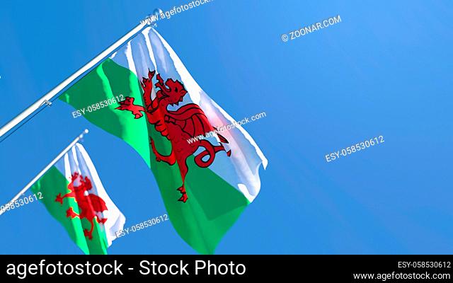 3D rendering of the national flag of Wales waving in the wind against a blue sky