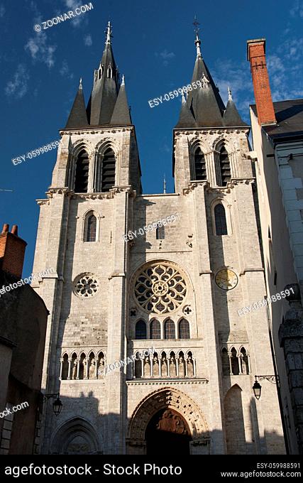 the sun on the facade of the church of saint nicolas in the historical center of Blois