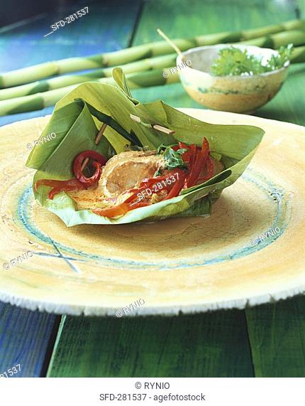 Ngobplah Fish in banana leaf basket, Thailand