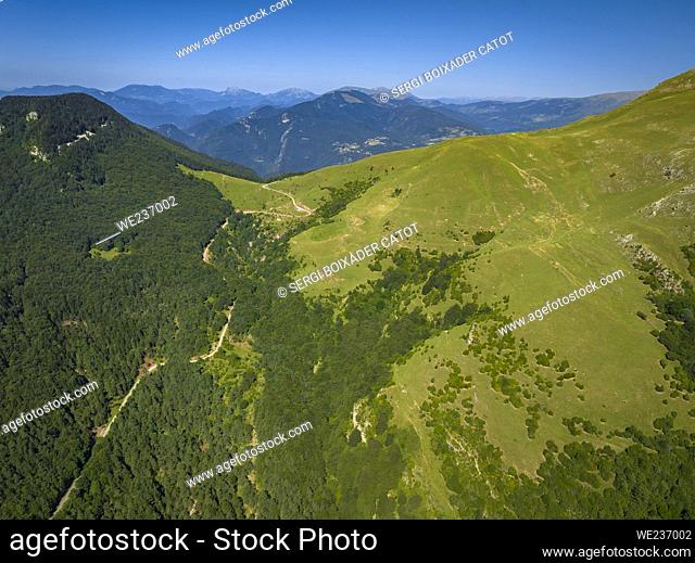 Aerial view of the Coll de Jou pass, which separates the mountains of Sant Amand from Taga and Serra Cavallera range, in Ripollès (Girona, Catalonia, Spain