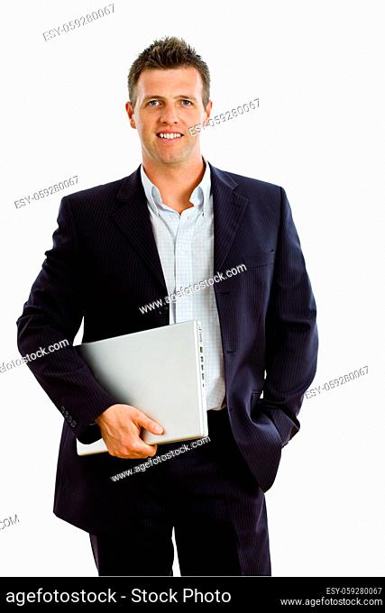 Happy businessman holding laptop computer, smiling, isolated on white