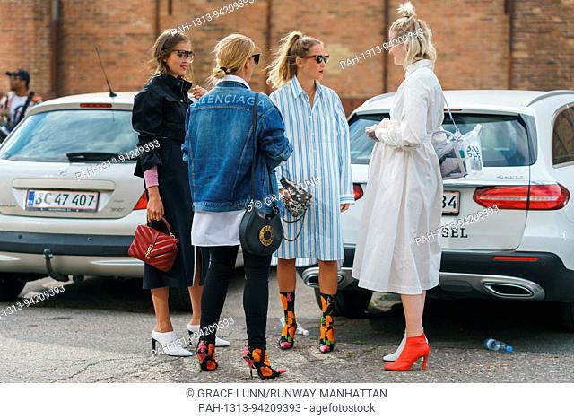 Darja Barannik, Janka Polliani, blogger and stylist Line Langmo, and Marianne Theodorsen posing outside the Ganni runway show during Copenhagen Fashion Week -...