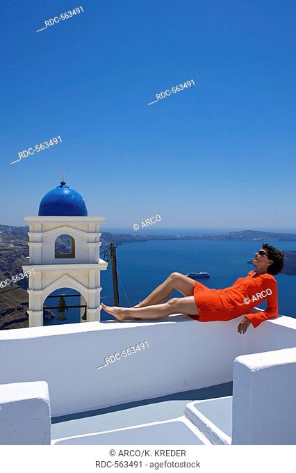 Relaxing woman in a Hotel in Imerovigli, Santorini, Cyclades, Greece MR