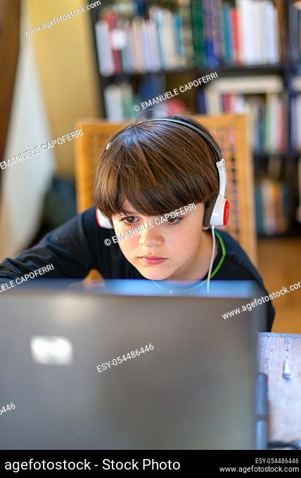 child attends online school lessons because of covid 19 quarantine