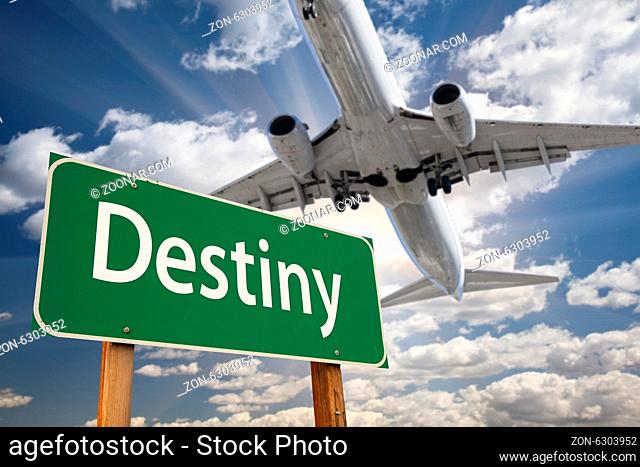 Destiny Green Road Sign and Airplane Above with Dramatic Blue Sky and Clouds