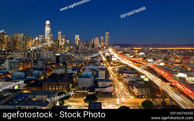 Cars go into and out of San Francisco Downtown night time rush hour
