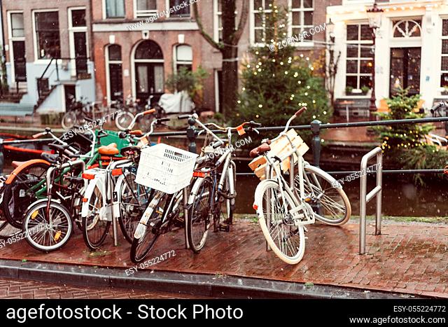 Bicycles lining a bridge over the canals of Amsterdam, Netherlands