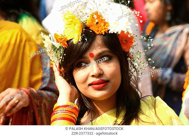 Dhaka 15 February 2015. Young Bangladeshi women decorate themselves with flowers during the ‘Basanto Utsav’ the first day of spring at Dhaka University Fine...