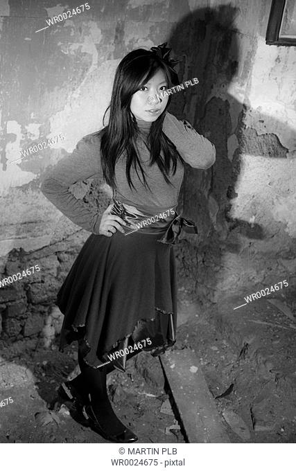 beautiful asian girl posing in abandoned castle