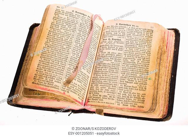 Old gothic antique vintage open bible with bookmark isolated on white background with cliping path