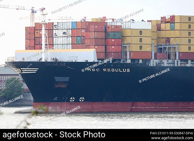 11 October 2023, Hamburg: The container ship ""MSC Regulus"" is moored on the Elbe near Finkenwerder. The 366-meter-long ship has moored in Finkenwerder with...