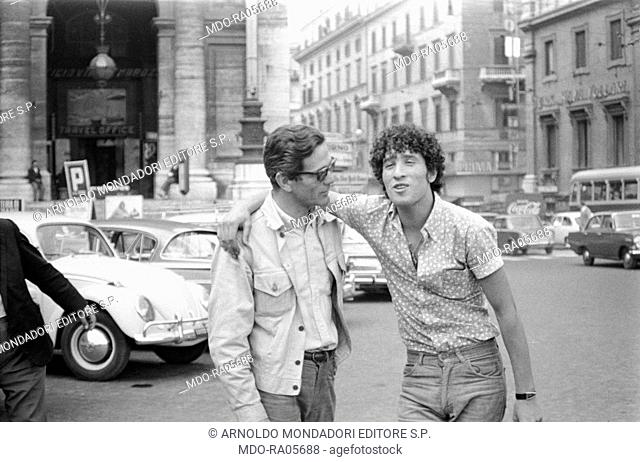 Italian writer and director Pier Paolo Pasolini talking to talian actor Ninetto Davoli on the set of the segment The sequence of the paper flower