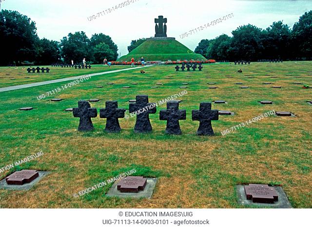 Europe, France La Comb, German War Cemetery with military crosses in groups of Five marking plot areas and large center mound with statuary