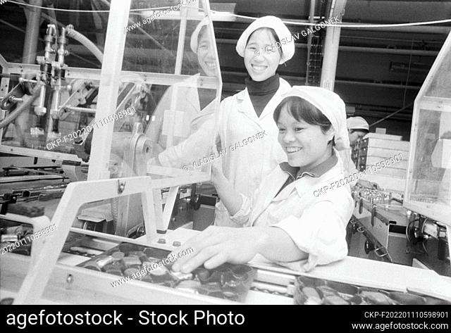 MARCH 1, 1982 FILE PHOTO***The young Vietnamese worker Nguyen Thi Lan (right) and Ngueyen Thi Xuan control the operation of the Autobal (packing) automatic line...