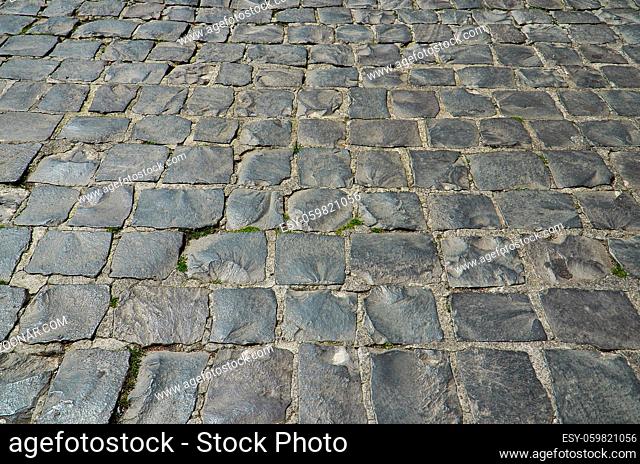 Rough tiles stone pavement, background