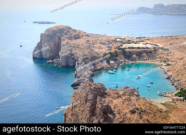 Panoramic view of Saint Pauls Bay in shape of heart from Acropolis of ancient city of Lindos, Rhodes, Greece