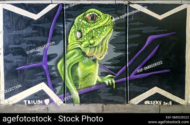 Green reptile, graffiti, underground passway Baratashvili Bridge, Tbilisi, Georgia