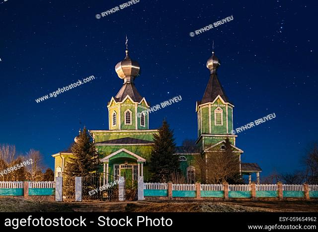 Old Russian Wooden Orthodox Church Of The Holy Trinity Under Night Starry Sky In Village Krupets, Dobrush District, Gomel Region, Belarus