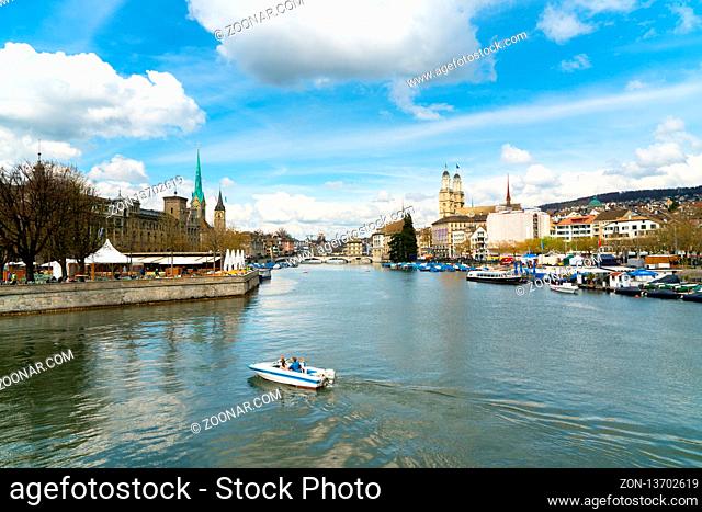 Zurich, ZH / Switzerland - April 8, 2019: Zurich cityscape with the river Limmat during the traditional spring festival of Sechselauten in April