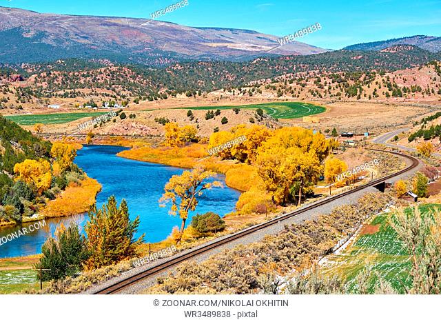 Landscape with autumn trees and river. Rocky Mountains, Colorado, USA