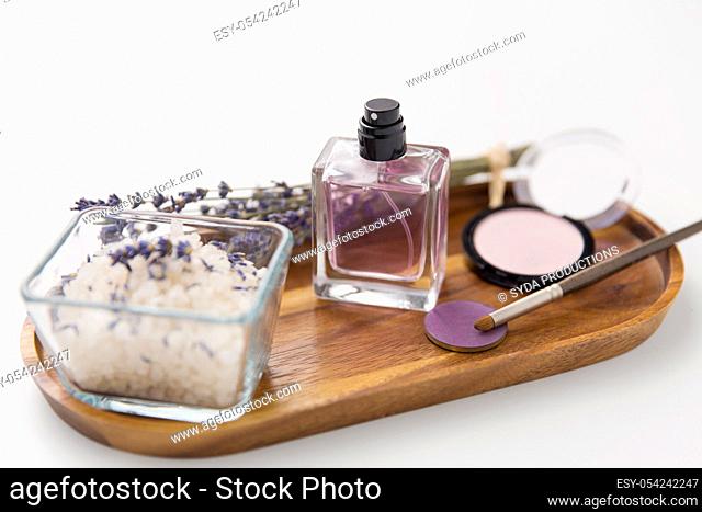 sea salt, perfume and lavender on wooden tray