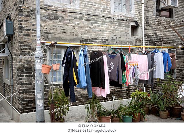 Laundry hoisted outside an old residential house at Kam Tin, New Territories, Hong Kong
