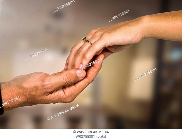 Wedding engaged couple holding hands with blurred background