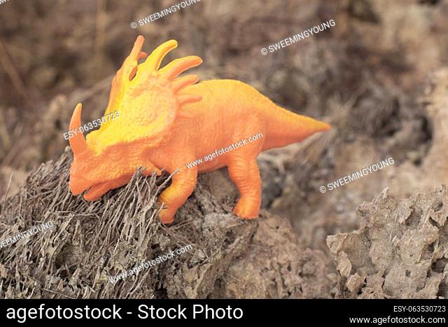 infrared image of the dinosaur toys on the dried deforested land
