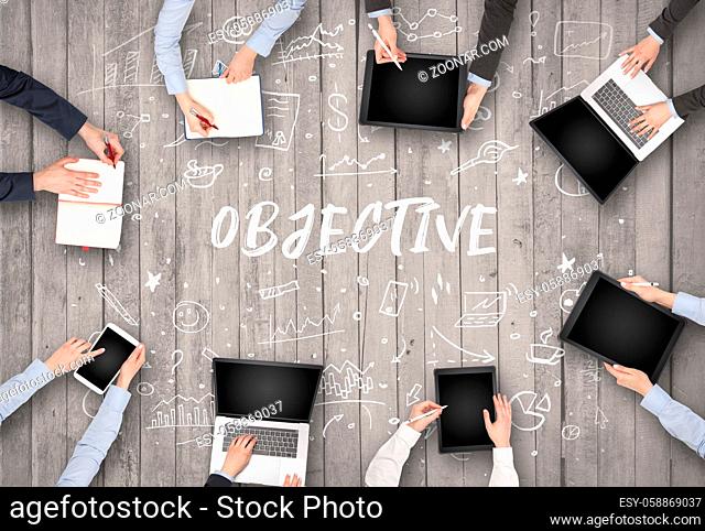 Group of business people working in office with OBJECTIVE inscription, coworking concept