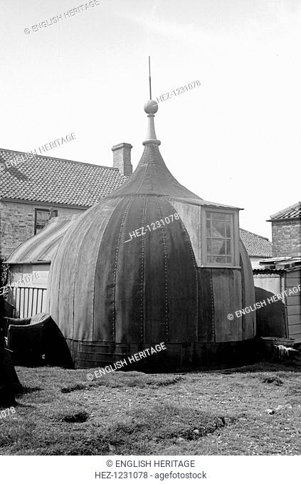 Tottenhill mill yard, Sporle, Norfolk, 1936. A window has been inserted into a former mill cap to provide adequate lighting for its new use as an outbuilding in...