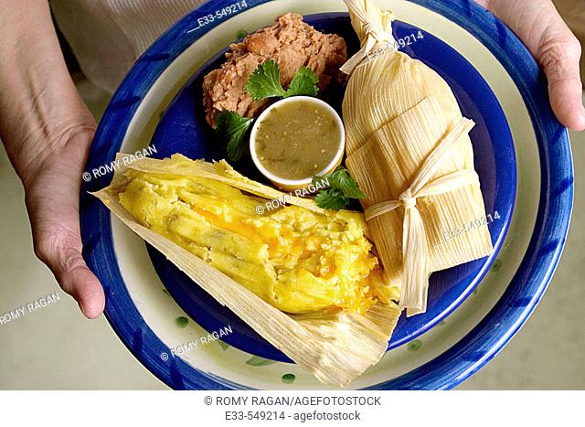 Vegetarian plate - cheese tamale and refried beans