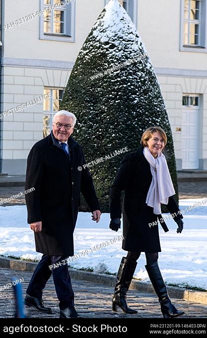 01 December 2023, Berlin: Federal President Frank-Walter Steinmeier and his wife Elke Büdenbender light the lights on the Christmas tree in front of Bellevue...