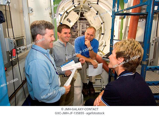 Astronauts Stephen N. Frick (left), STS-122 commander; Rex J. Walheim and European Space Agency's (ESA) Hans Schlegel, both mission specialists; and Peggy A