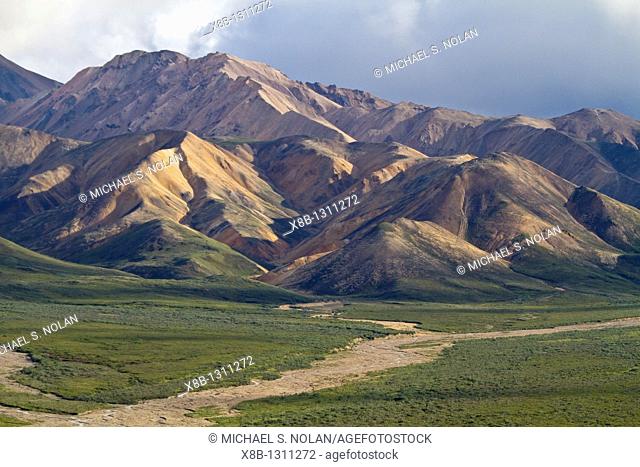 A view of the Polychrome many-colored Mountains from a lookout point on the park road inside Denali National Park and Preserve , Alaska, USA