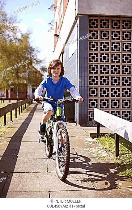 Portrait of boy cycling