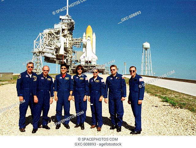 11/07/2001 -- On the launch pad, the STS-108 crew and Expedition 4 crew pause for a photo during Terminal Countdown Demonstration Test activities