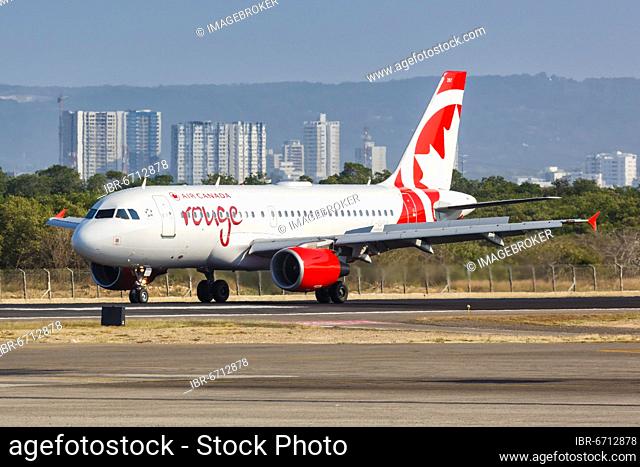 An Air Canada Rouge Airbus A319 aircraft with registration C-GITR at Cartagena Airport, Colombia, South America
